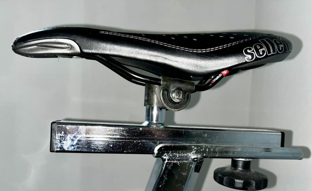 spinning bike saddle clamp and dual rail saddle side view