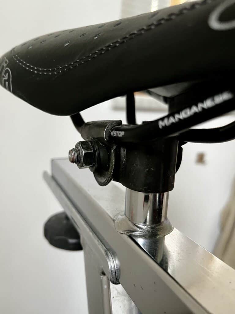 spinning bike saddle clamp and dual rail saddle from view and screw