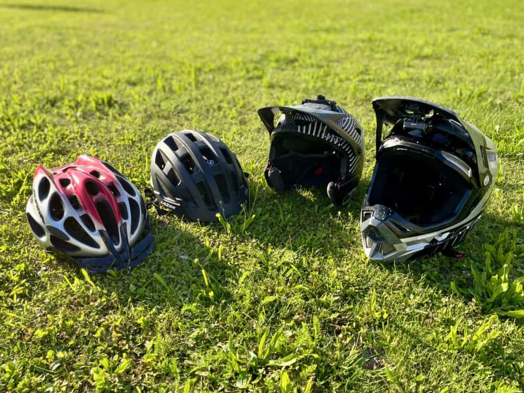 road and mountain bike helmets side by side