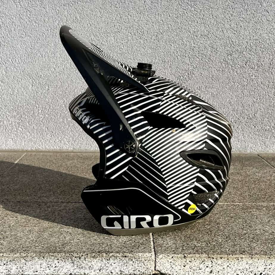 A Giro Switchblade MTB Helmet from the side with the visor tilted up